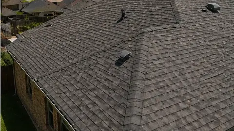 Dark storm clouds over Central Texas homes before a severe thunderstorm